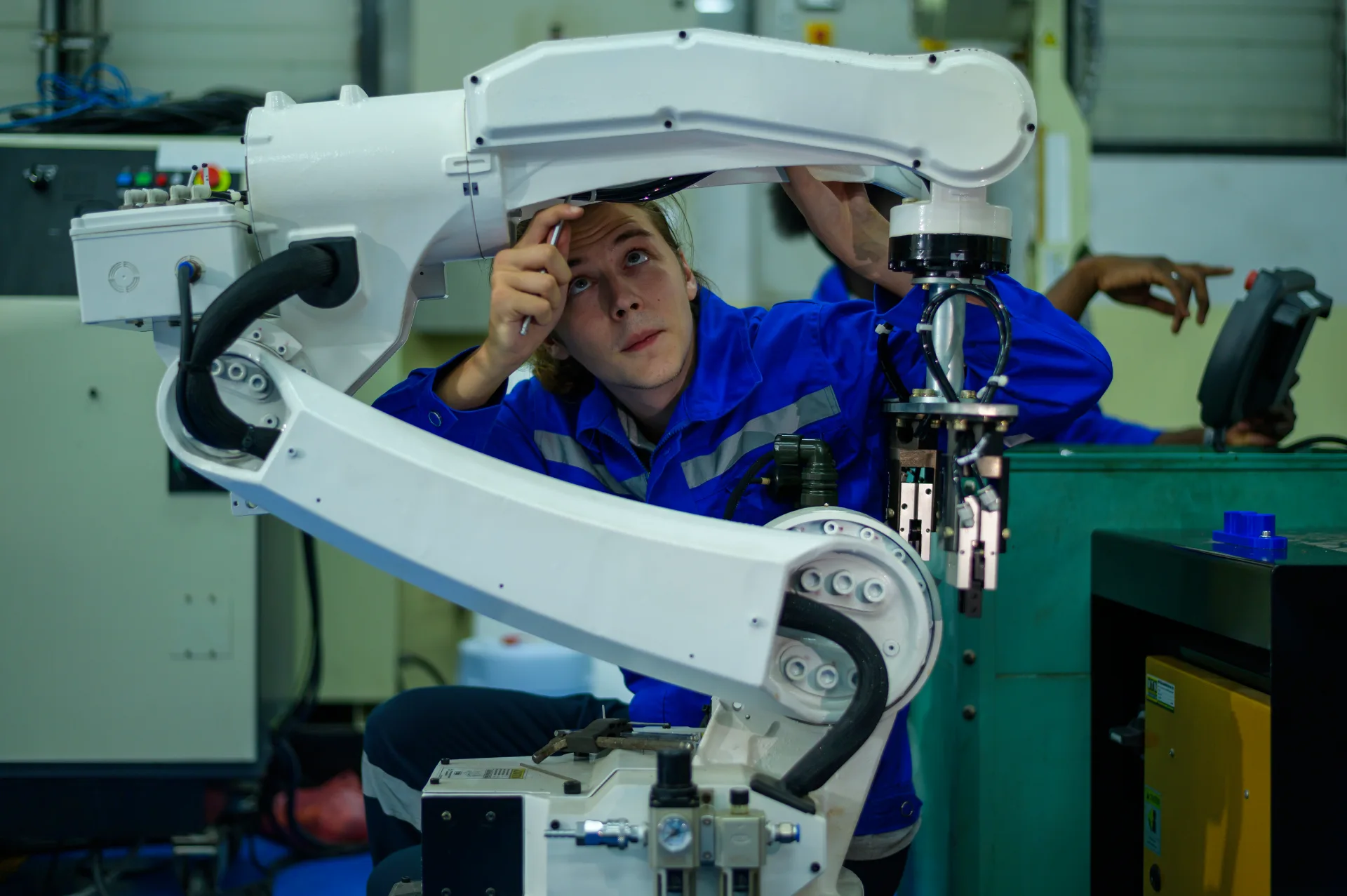 vecteezy_male-robotics-engineer-working-with-programming-and_43238154